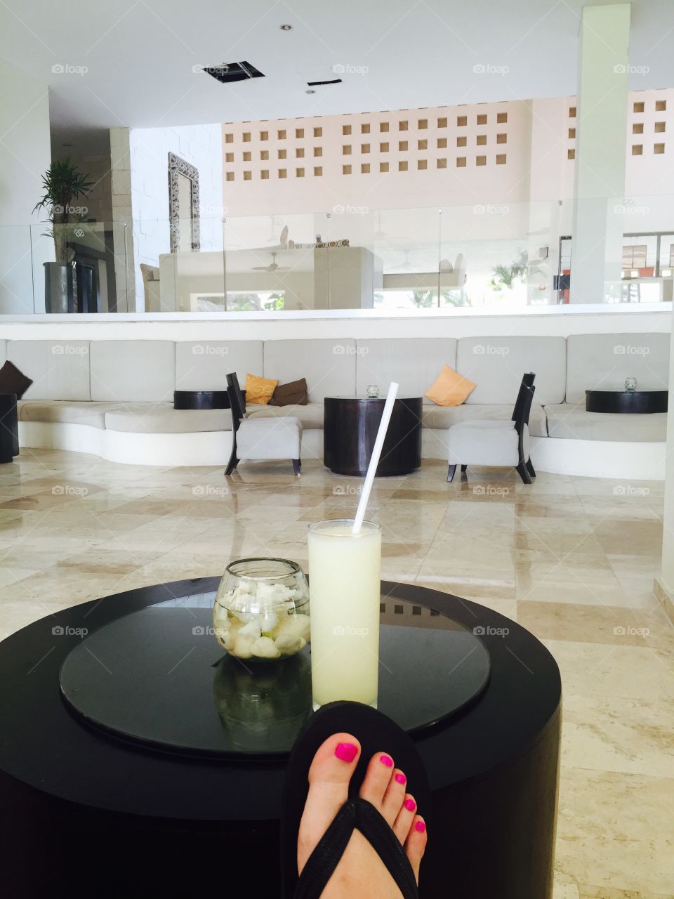 Lounging. Relaxing at hotel lounge with piña colada