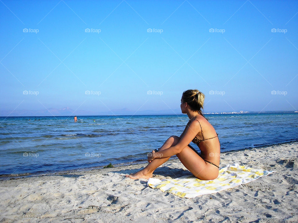 A girl alone on the beach