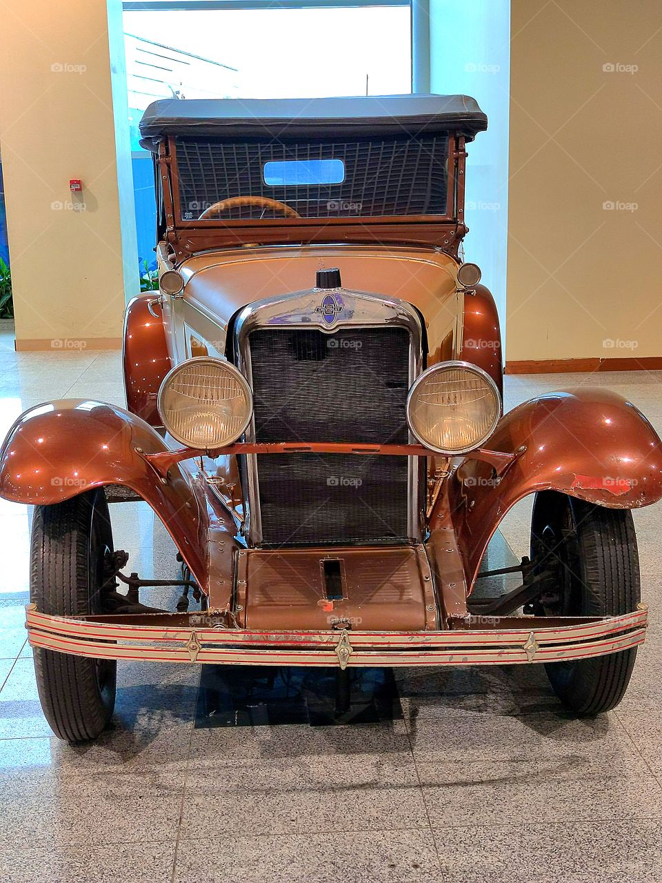 Brown car.  "Chevrolet AC Open Tourer".  USA. 1929 year of release.  Front view.  Retro cars