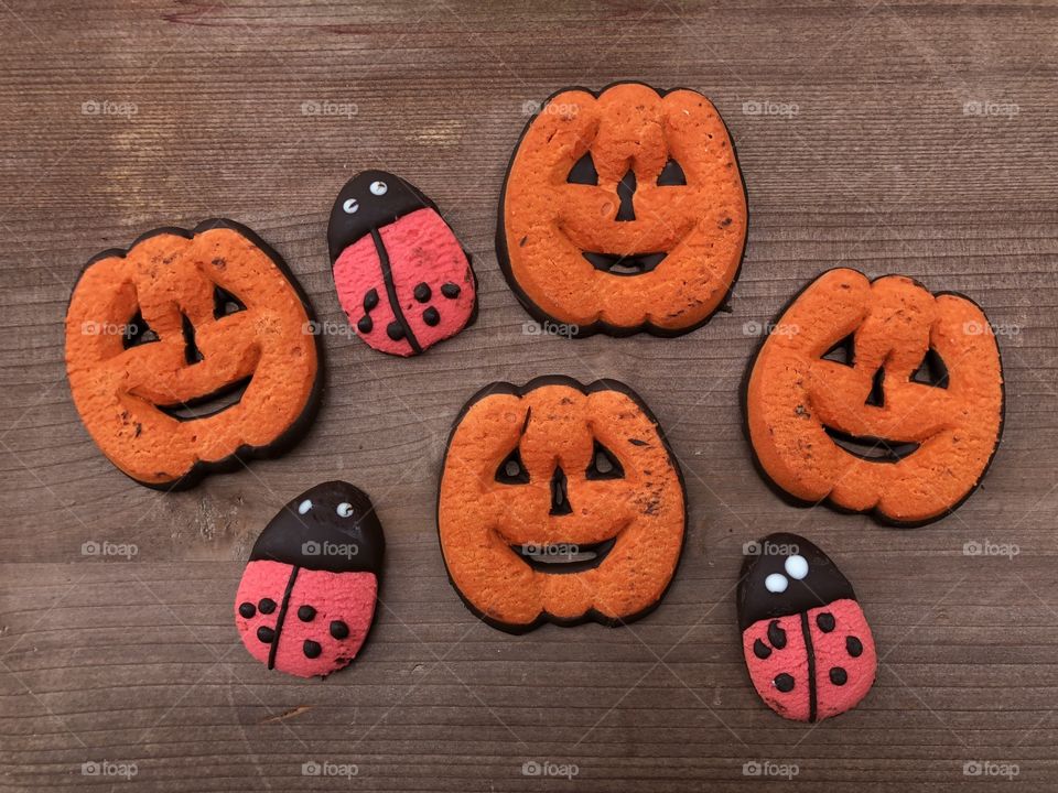 Homemade pastry cookies for Halloween in the form of pumpkins and ladybugs