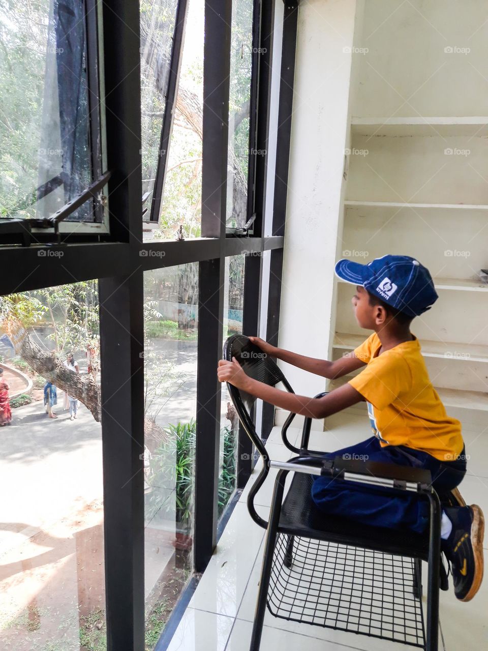 Kid looking through the window