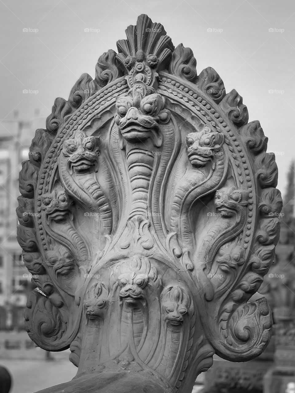 Naga Hindu mythical creature stone sculpture at at the Baron Palace, Heliopolis - Cairo, Egypt. 