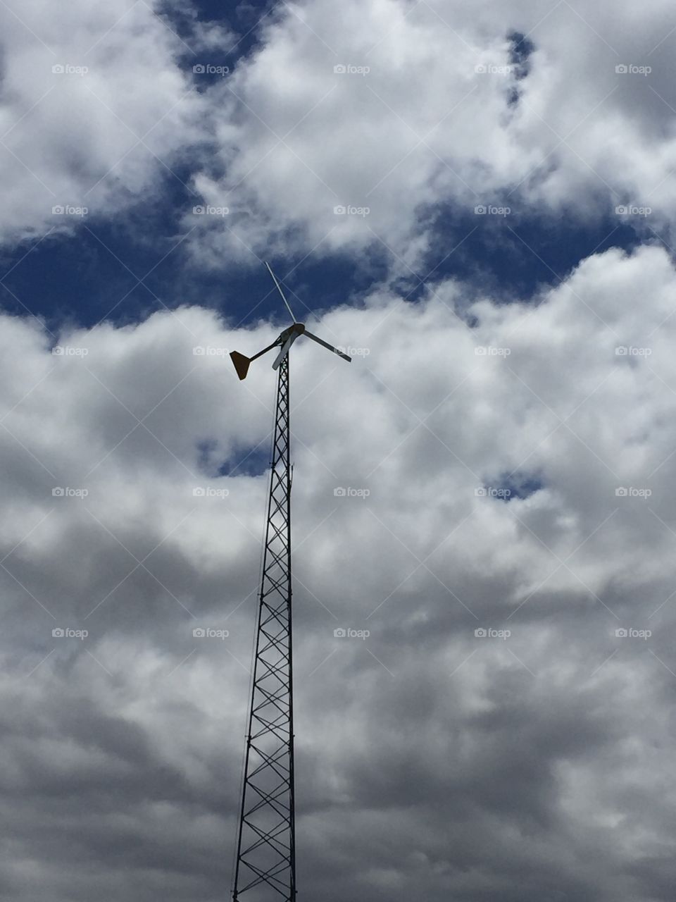Windmill against clouds