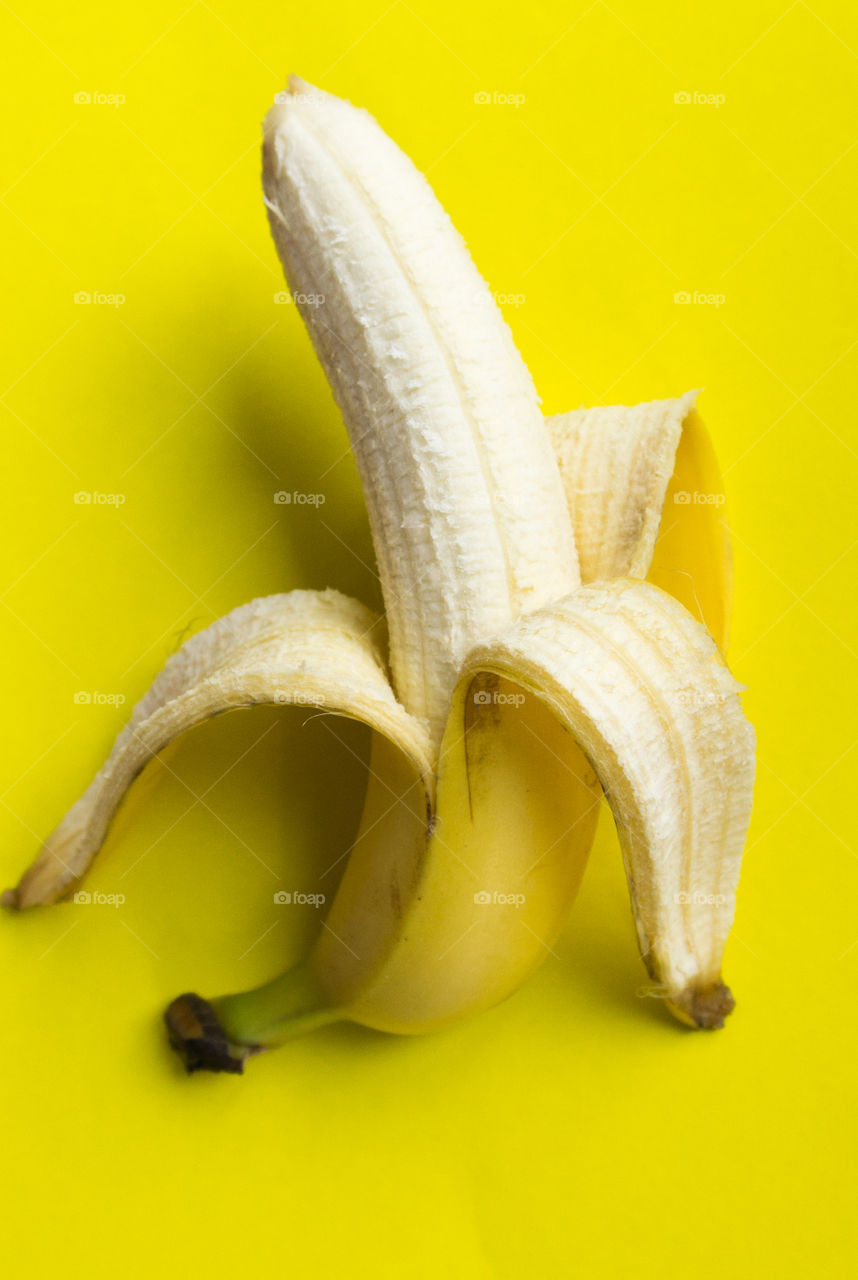 yellow banana on a yellow background