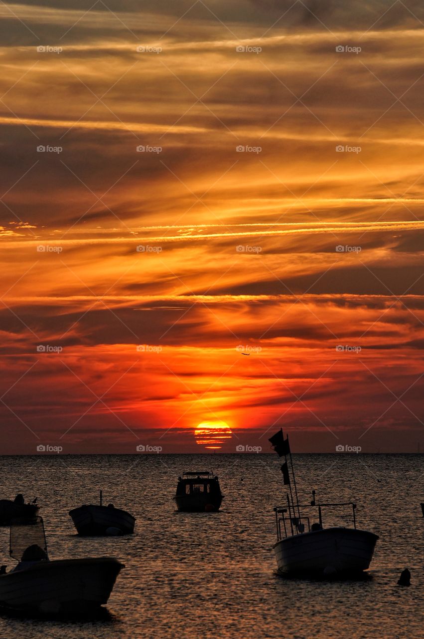 Silhouette of boat during sunset