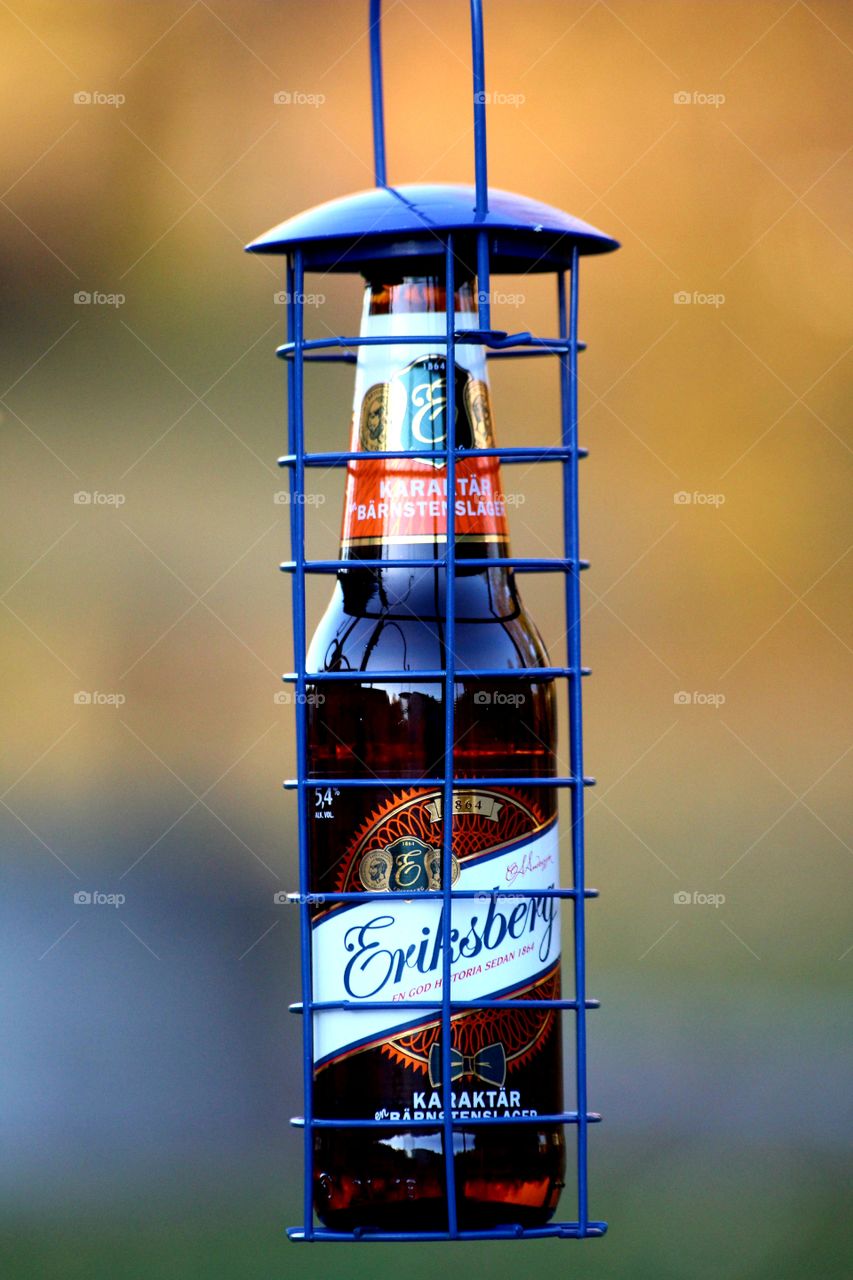 beer bottle behind bars