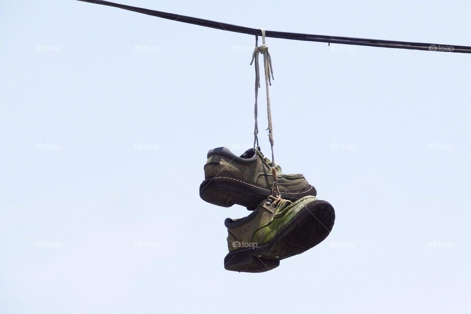 Shoefiti outdoors by a retired fire station.