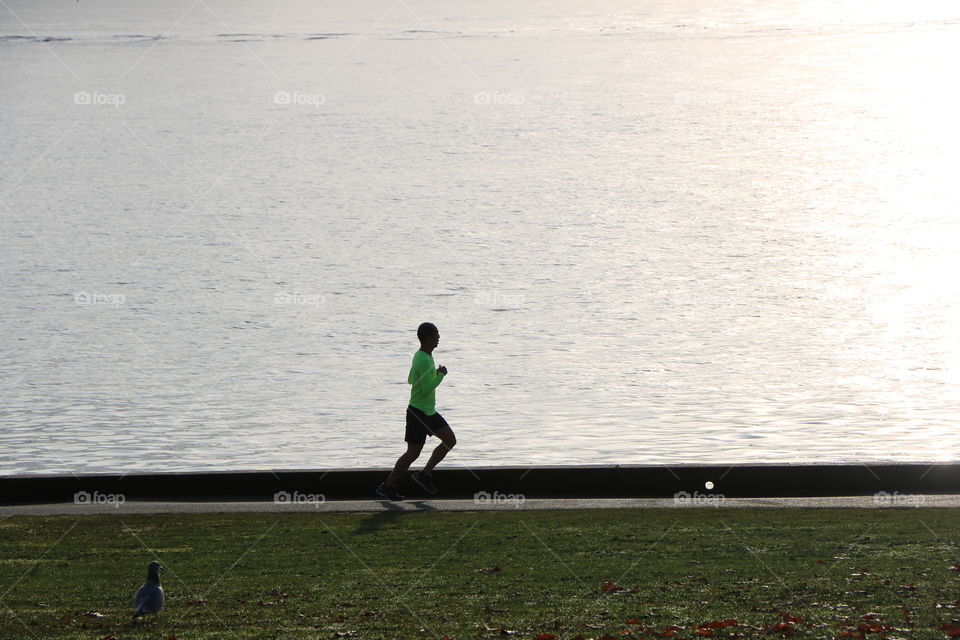 Man running by the ocean, his every day routine 