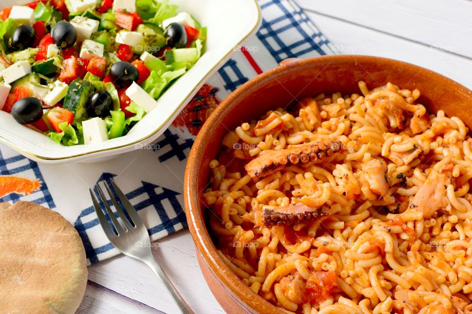 Close-up of greek salad and seafood