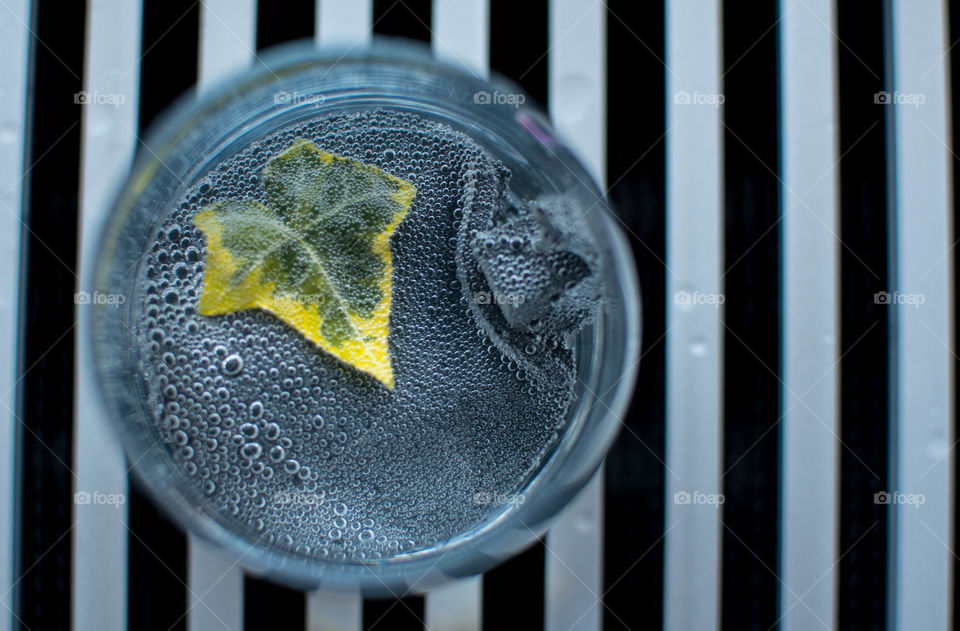 High angle view of autumn leaf in glass