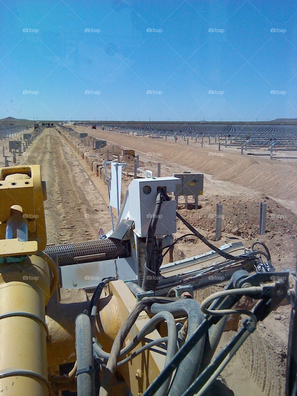 Working the padder on a solar farm install 