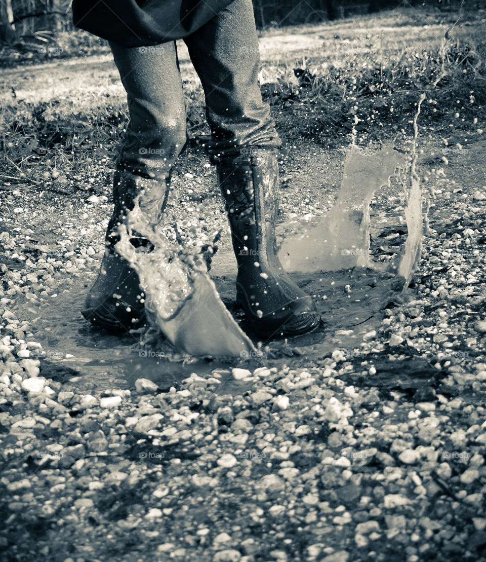puddle jumping action shot, in black and white