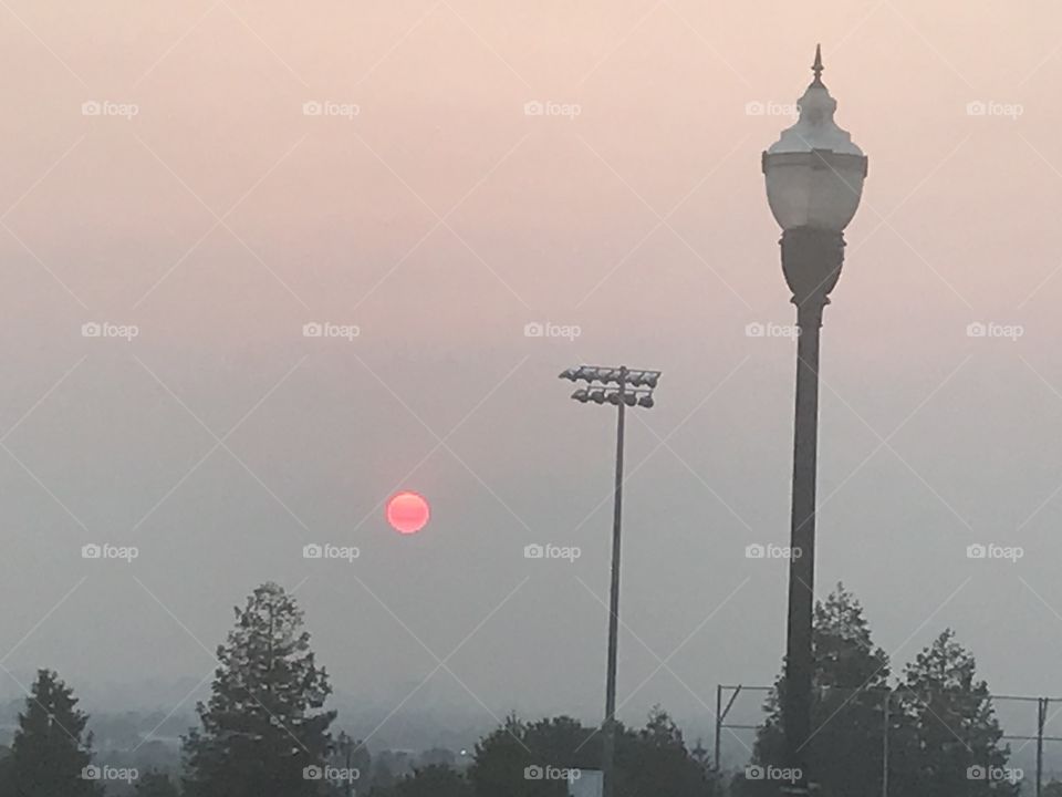 Evening red sun in smoky California 