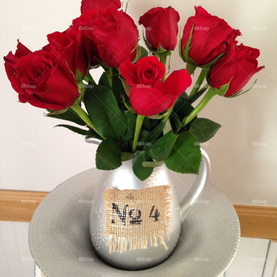 Roses of love . Bright lush roses in a shabby chic vase 