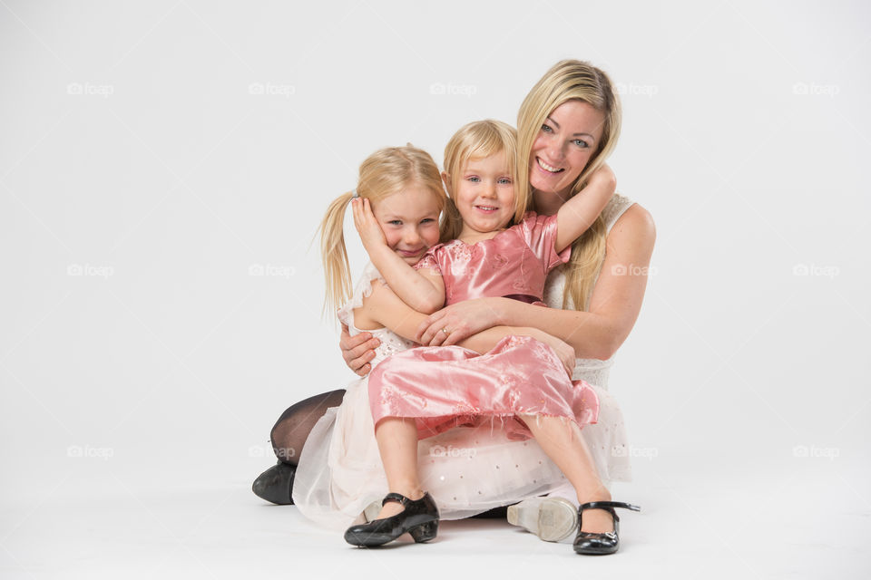 Happy family, mother with her two daughters of 6 and four years old.