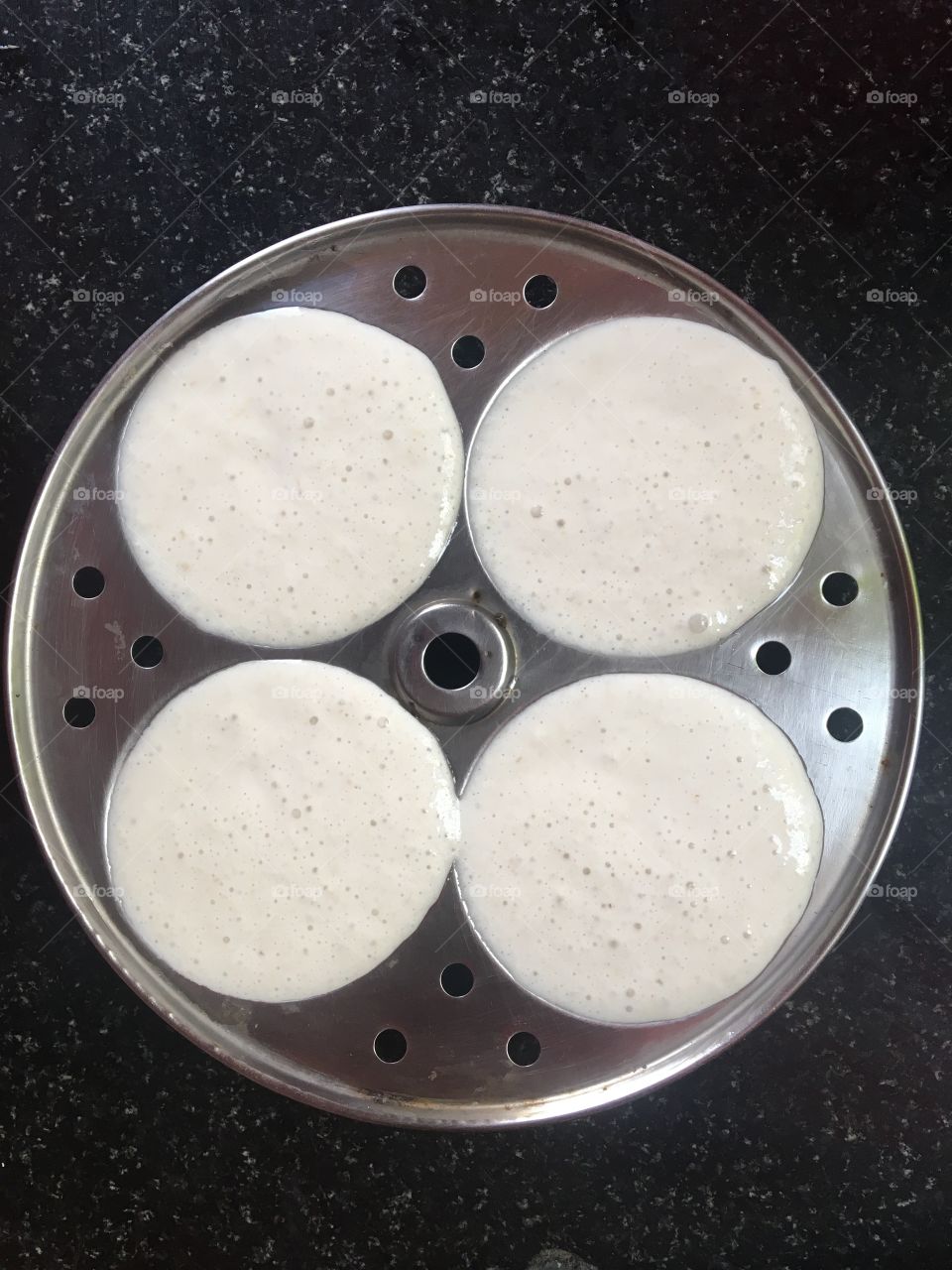 Preparation of Idlies a South Indian dish