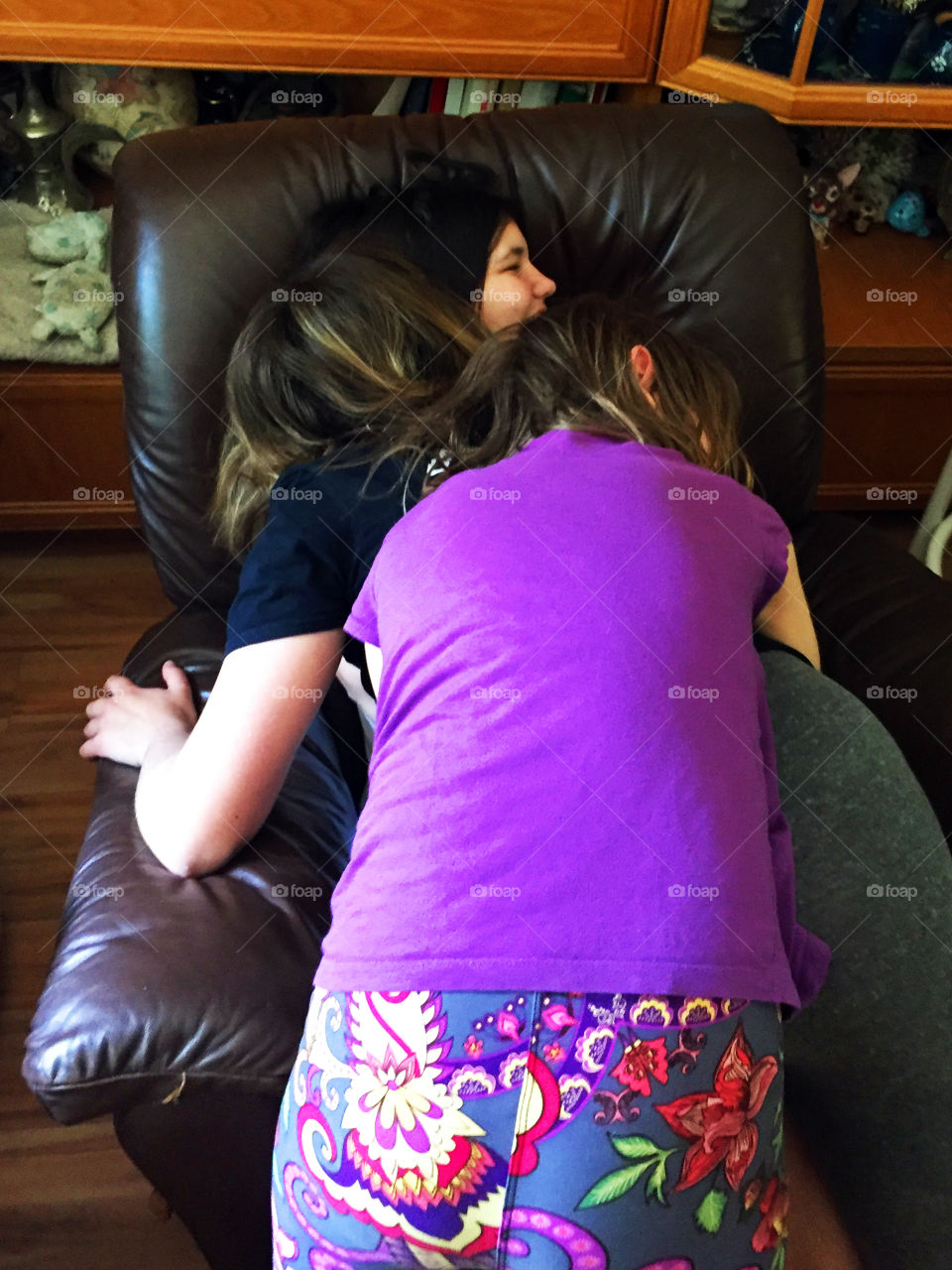 My favourite room in the house is the room where there is the most interaction with my family; my open kitchen -family room. Here my three girls are piling on each other to give big loving bear hugs to each other.  Home is where the heart is! ❤️