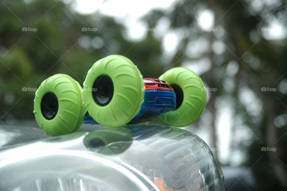 radio control car green wheel close up blur background