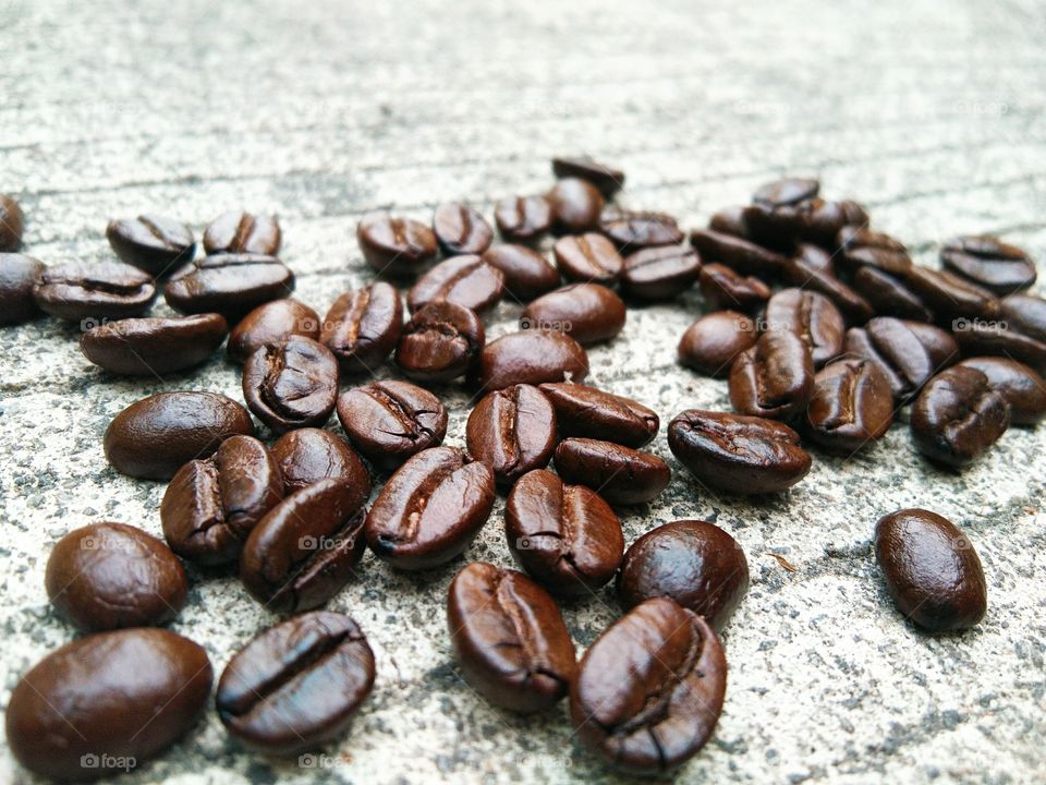 coffee beans on concrete floor