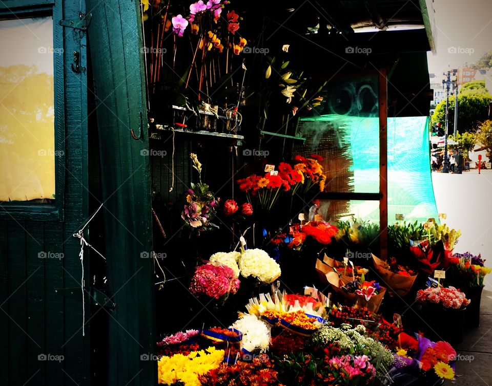 Beautiful colors and autumn flowers at the outdoor flower stall on the corner of Market Street and 16th Street, in the Castro district, of San Francisco, California. 