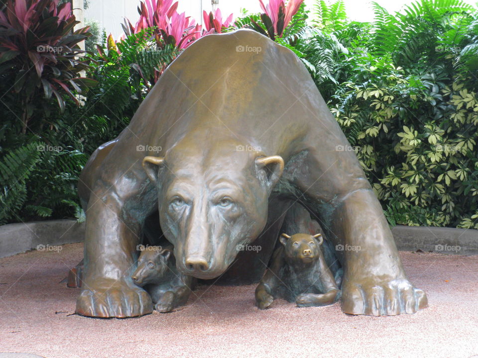 Mama polar bear and babies statute