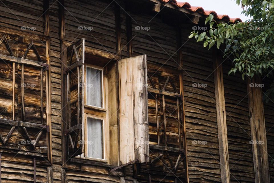 An old wooden house, a window 