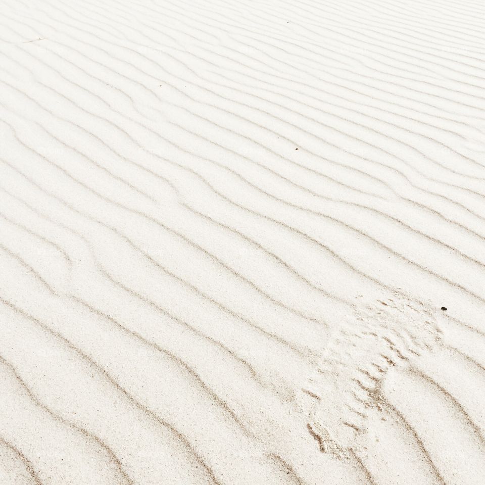 Footprint on white sand