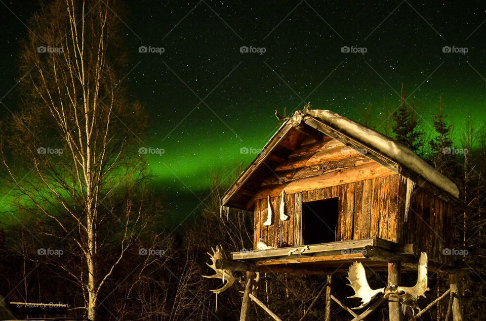 Hunters hut with northern lights