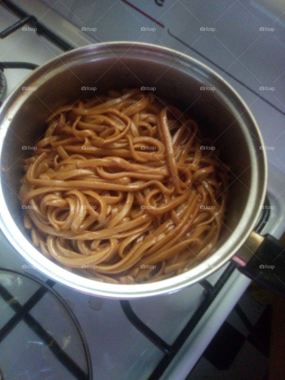 just looking at the pasta in the pot it is cook and put to cool down so we can  eat .
