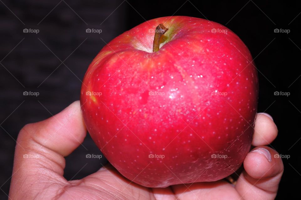 holding apple