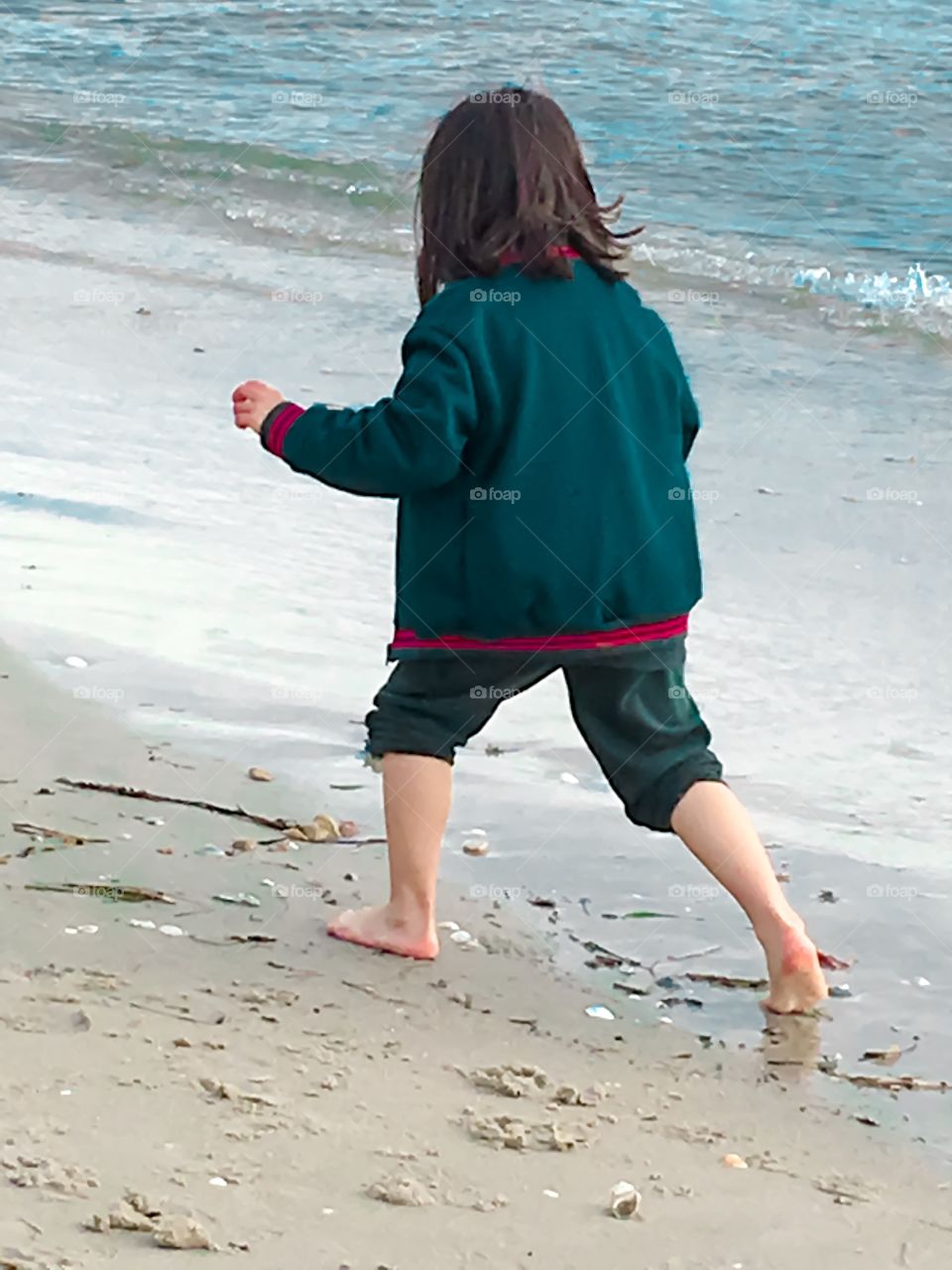 Young girl on beach south Australia overcast day