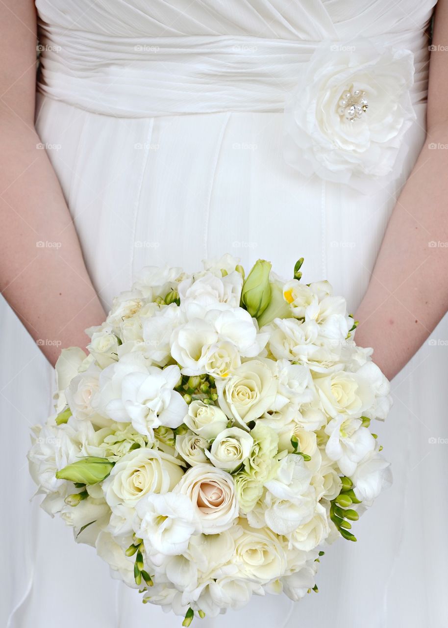 Close-up of bride holding beautiful bouquet