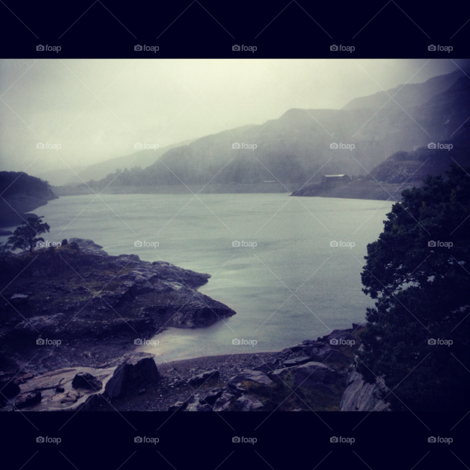 mountain grey lake rain by Tro23