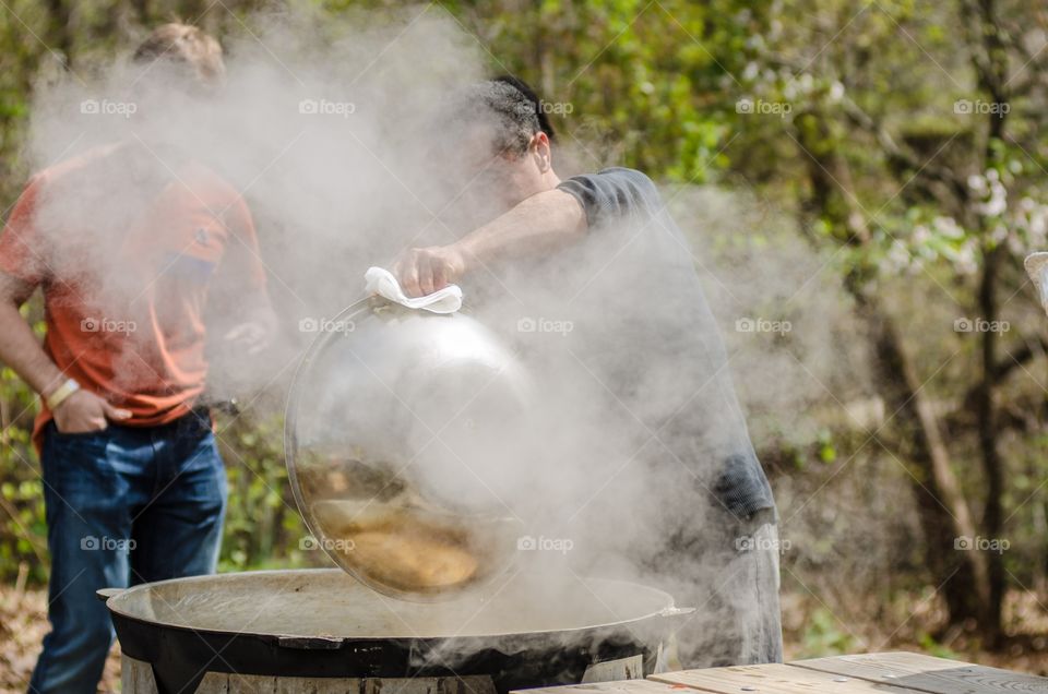 People preparing food outdoors