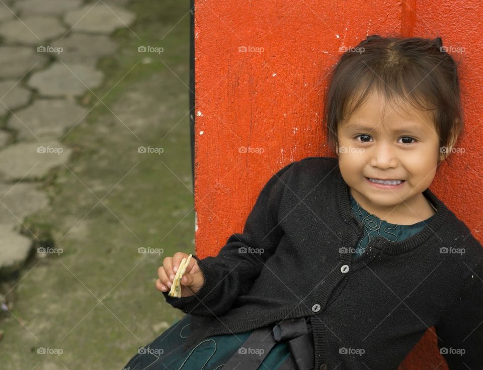 Guatemalan girl enjoying snack