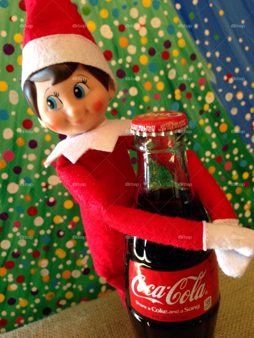 Elf on the Shelf loves a cold refreshing Coca-Cola!