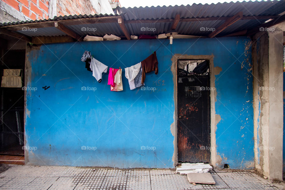 Clothes hanging in a poor house