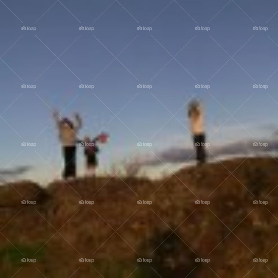 kids on a hill top