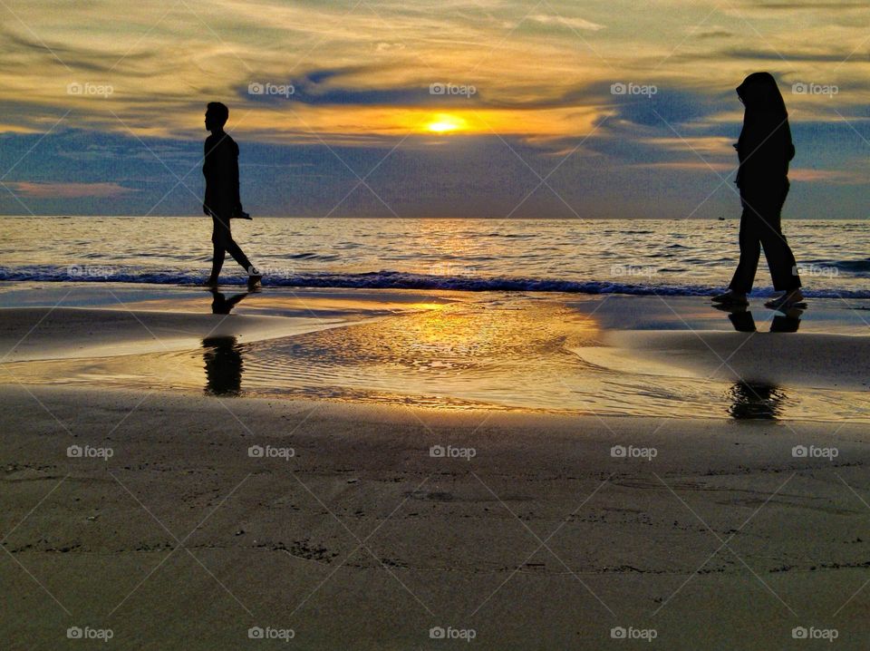 Beach walk in the sunset.