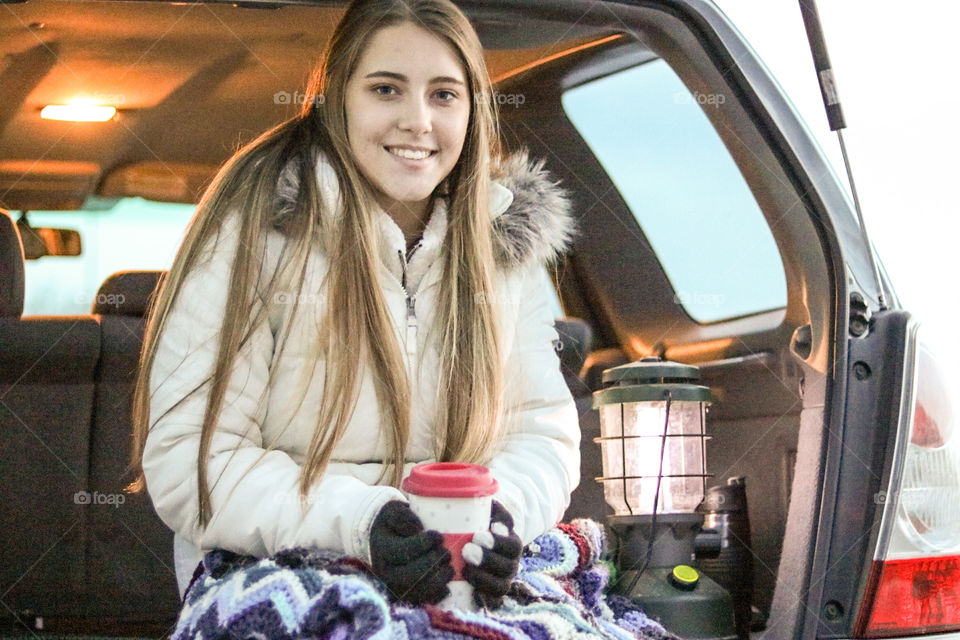 Winter Road Trip- my daughter staying warm on a family camping trip.