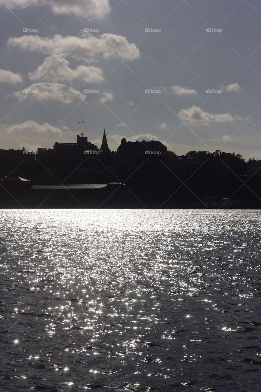 stockholm clouds sun water by kamrern