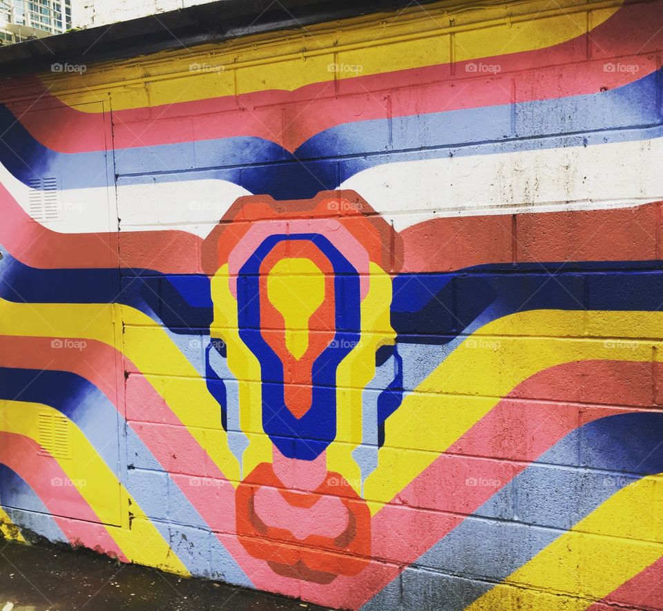 Colourful graffiti wall, pink blue and yellow