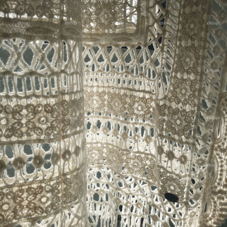 natural light shining through crochet textiles