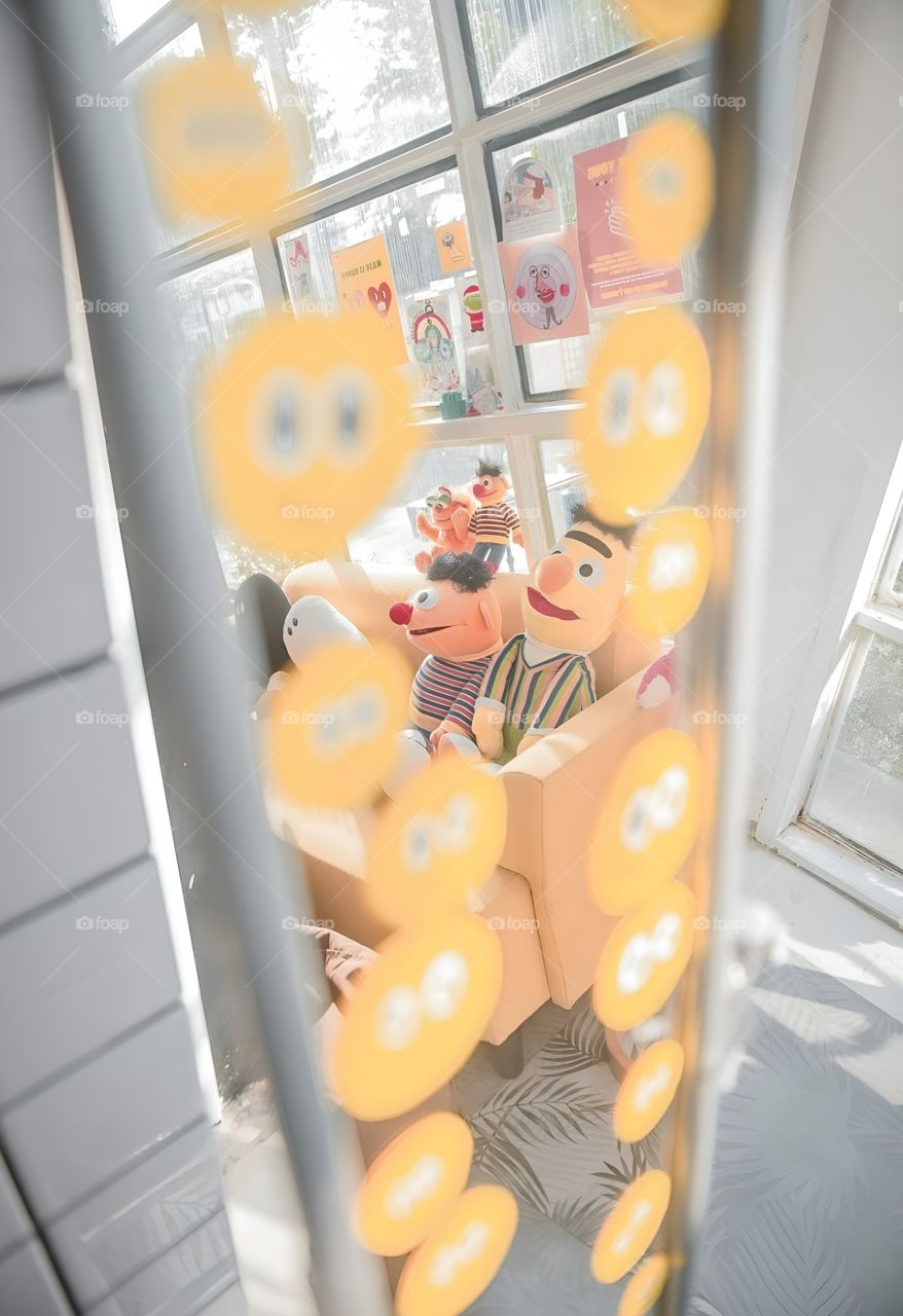 Smile stickers on the mirror reflect the doll