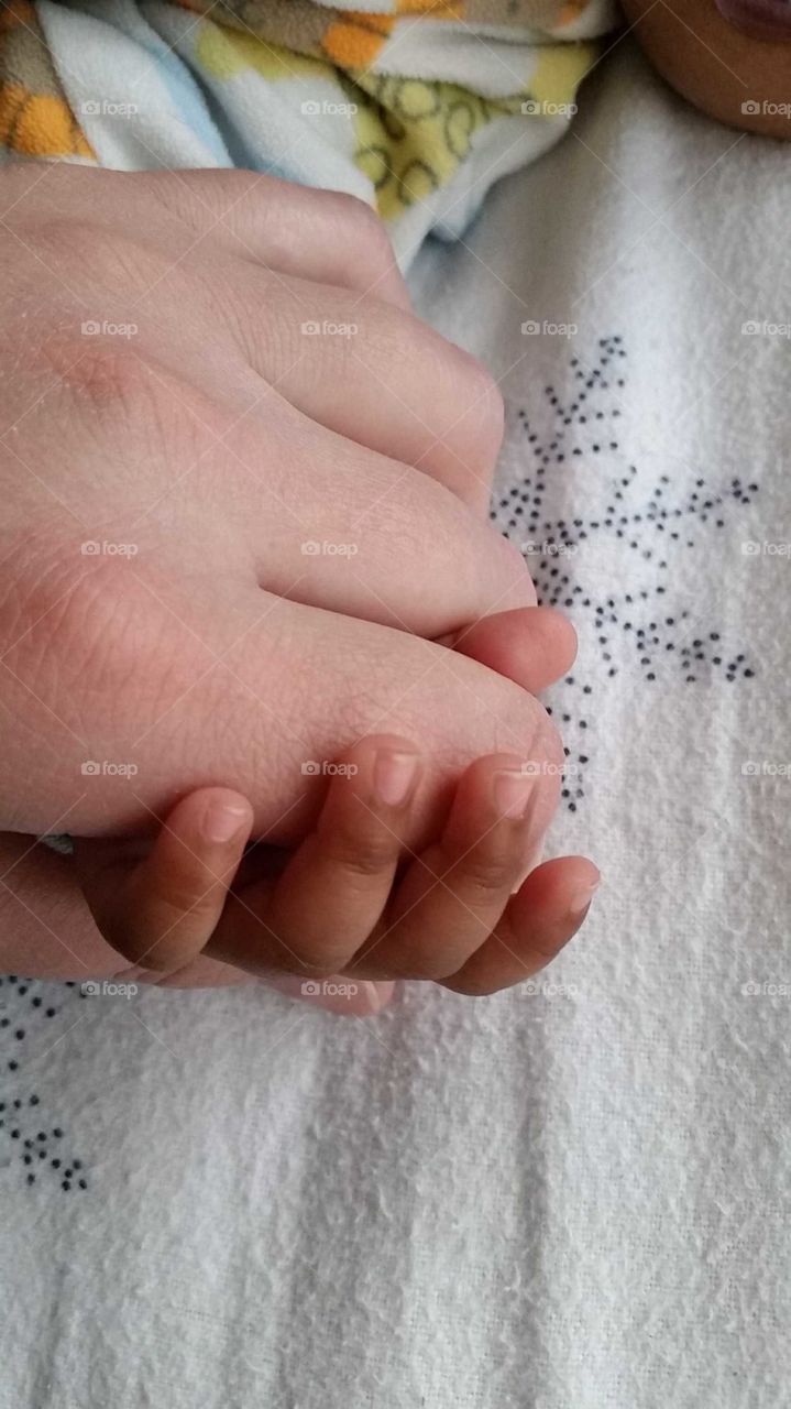 holding baby's hand, precious moments, protect them for as long as you can, treasure these moments