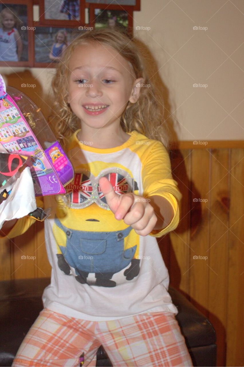 Portrait of a smiling girl playing with toys