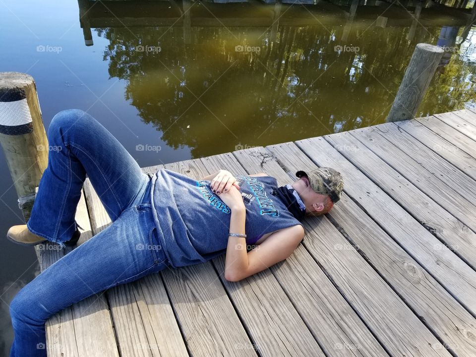 Country Girl Napping on Swamp Dock
