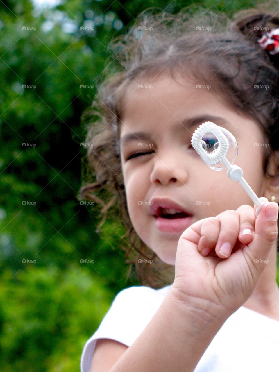 Small blows soap bubble