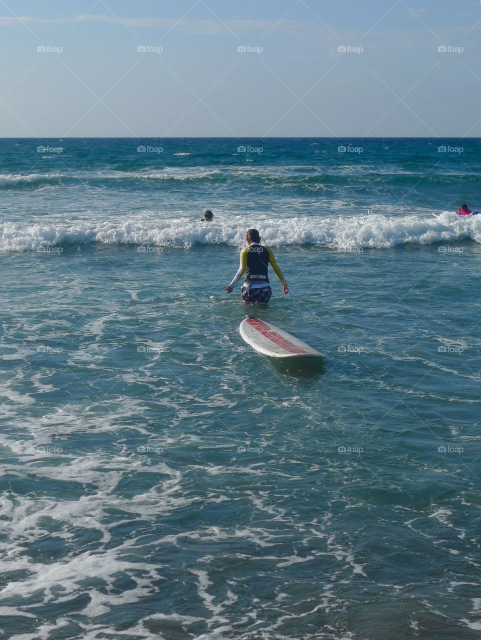 Learning to long board surfing in San Juan, La Union, Philippines 