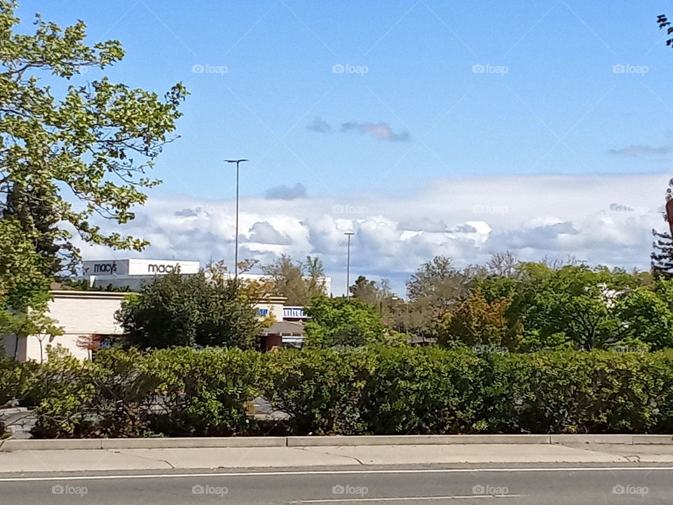 a beautiful day in the neighborhood of Sacramento California. Clouds over the Sierra mountains.